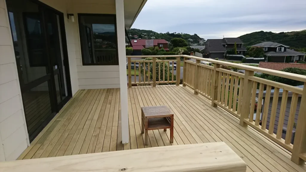 Spacious upper-level timber deck by Builders Silverdale, crafted by skilled deck builders overlooking a suburban view