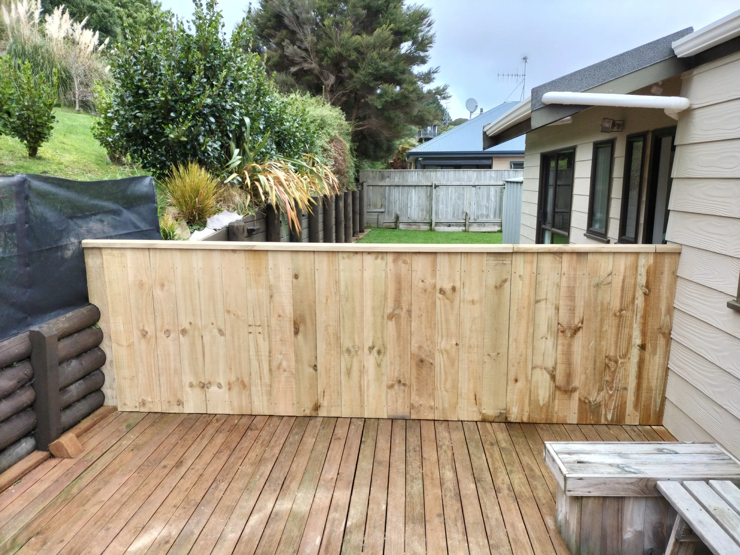Low timber privacy fence built on a deck by Builders Silverdale fencing contractors.