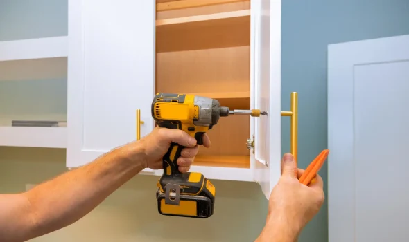 Precision cabinet handle installation during kitchen renovations by the expert team at Builders Silverdale