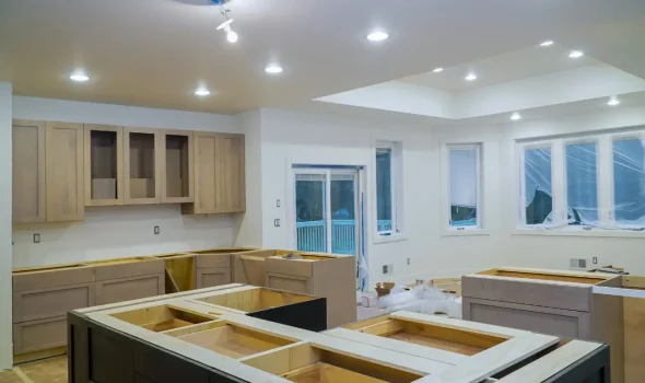 Spacious open plan kitchen under renovation with cabinetry being installed by Builders Silverdale skilled in kitchen renovations